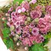 ピンクの大輪バラやスプレーマム、トルコキキョウの花束